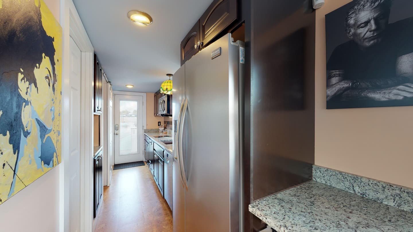 Kitchen and living space aboard The Famous Houseboat